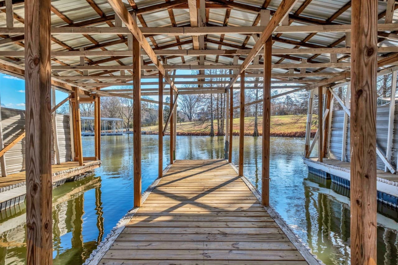 View down the wooden walkway inside the property’s two-slip boat dock